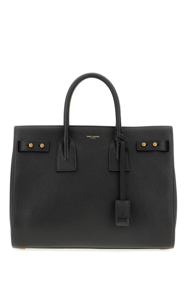 Stylish luxury designer handbags showcasing elegant black leather craftsmanship and polished hardware