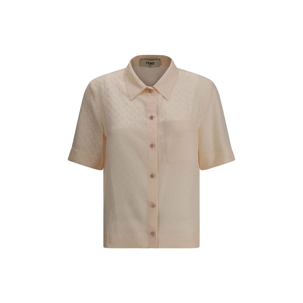 Elegant luxury women's shirts online featuring a sophisticated short-sleeve design in soft peach tones