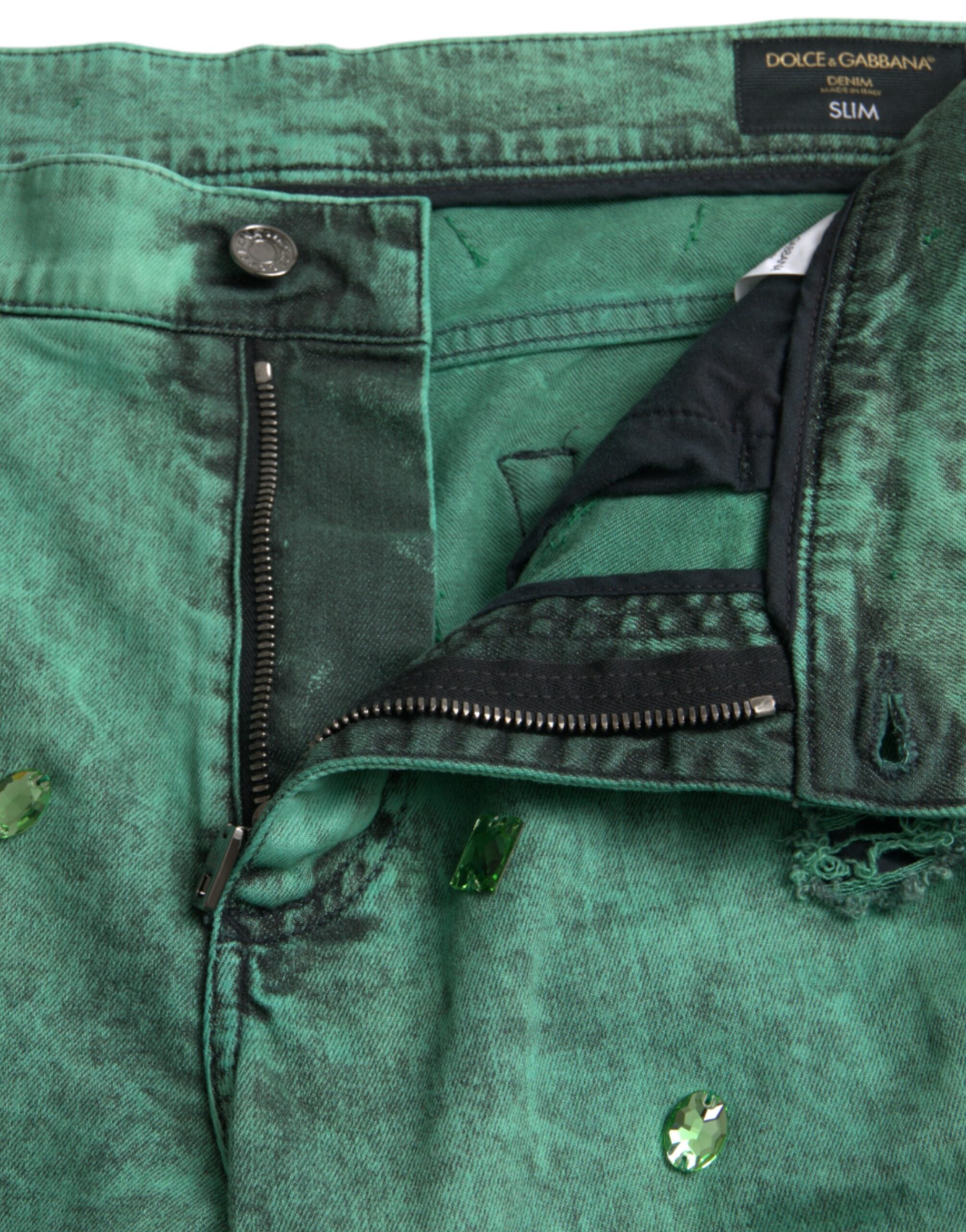 Dolce &amp; Gabbana – Eng anliegende Jeans aus Baumwollstretch mit grünen Kristallen