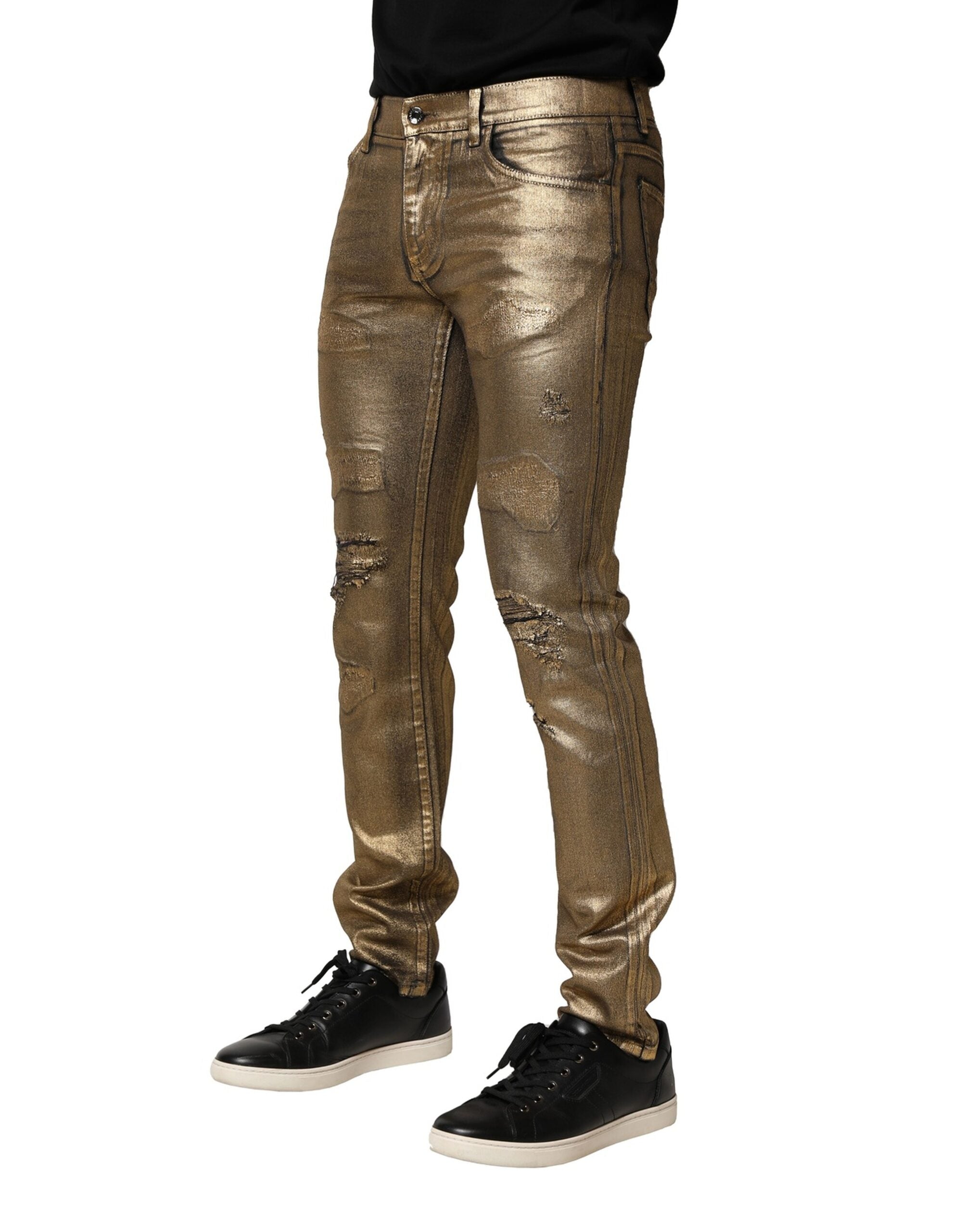 Dolce &amp; Gabbana – Schmal geschnittene Jeans aus zerfetzter Baumwolle mit Stretchanteil in Gold