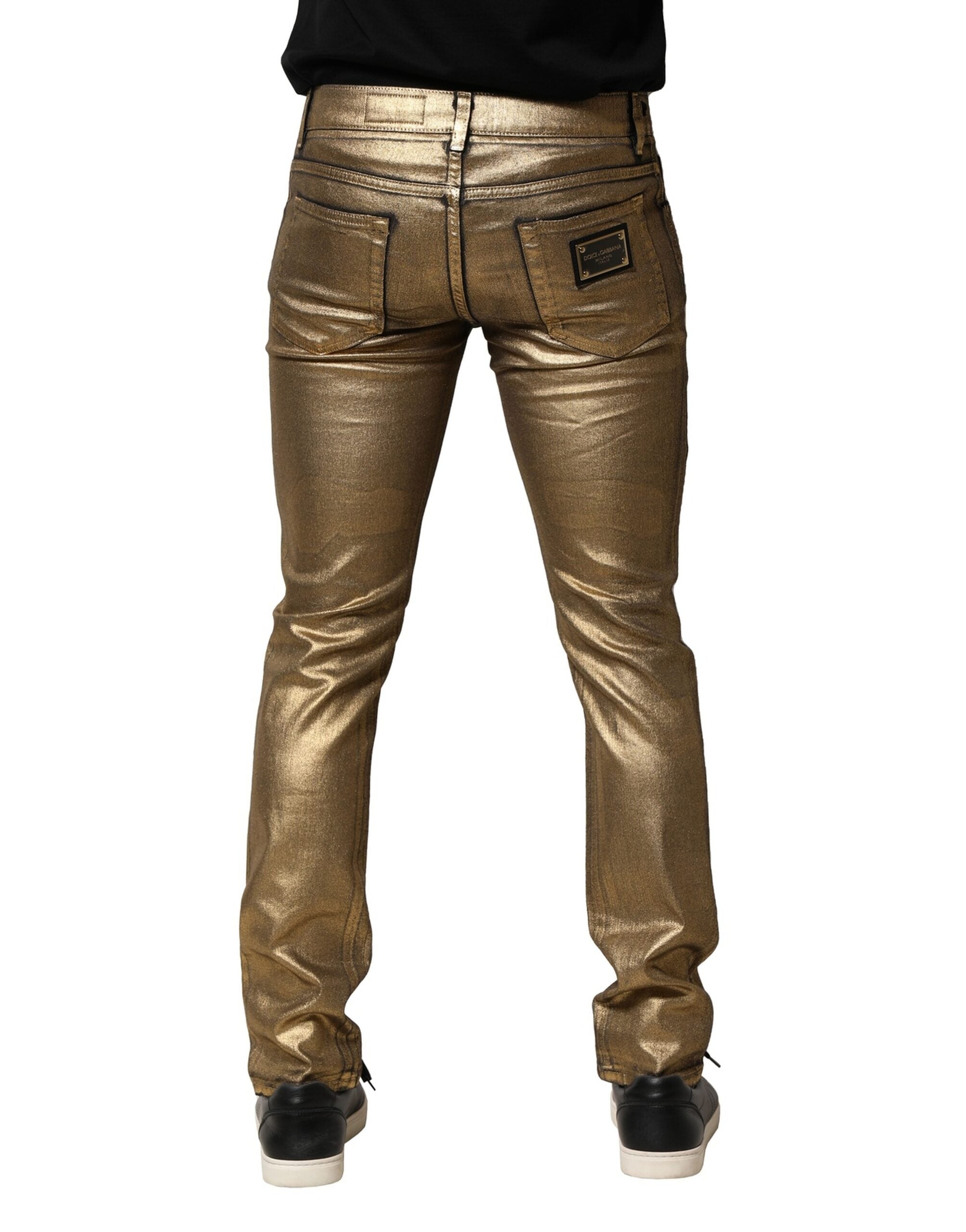 Dolce &amp; Gabbana – Schmal geschnittene Jeans aus zerfetzter Baumwolle mit Stretchanteil in Gold