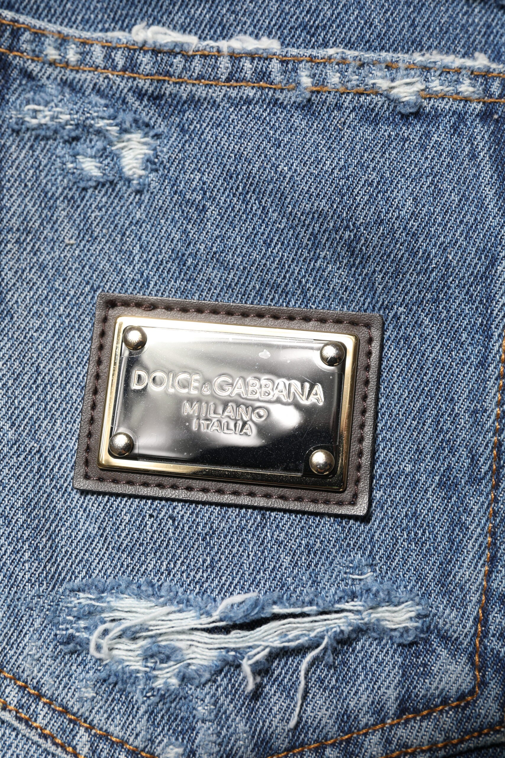 Jean en denim bleu à plaque logo Dolce &amp; Gabbana en coton déchiré