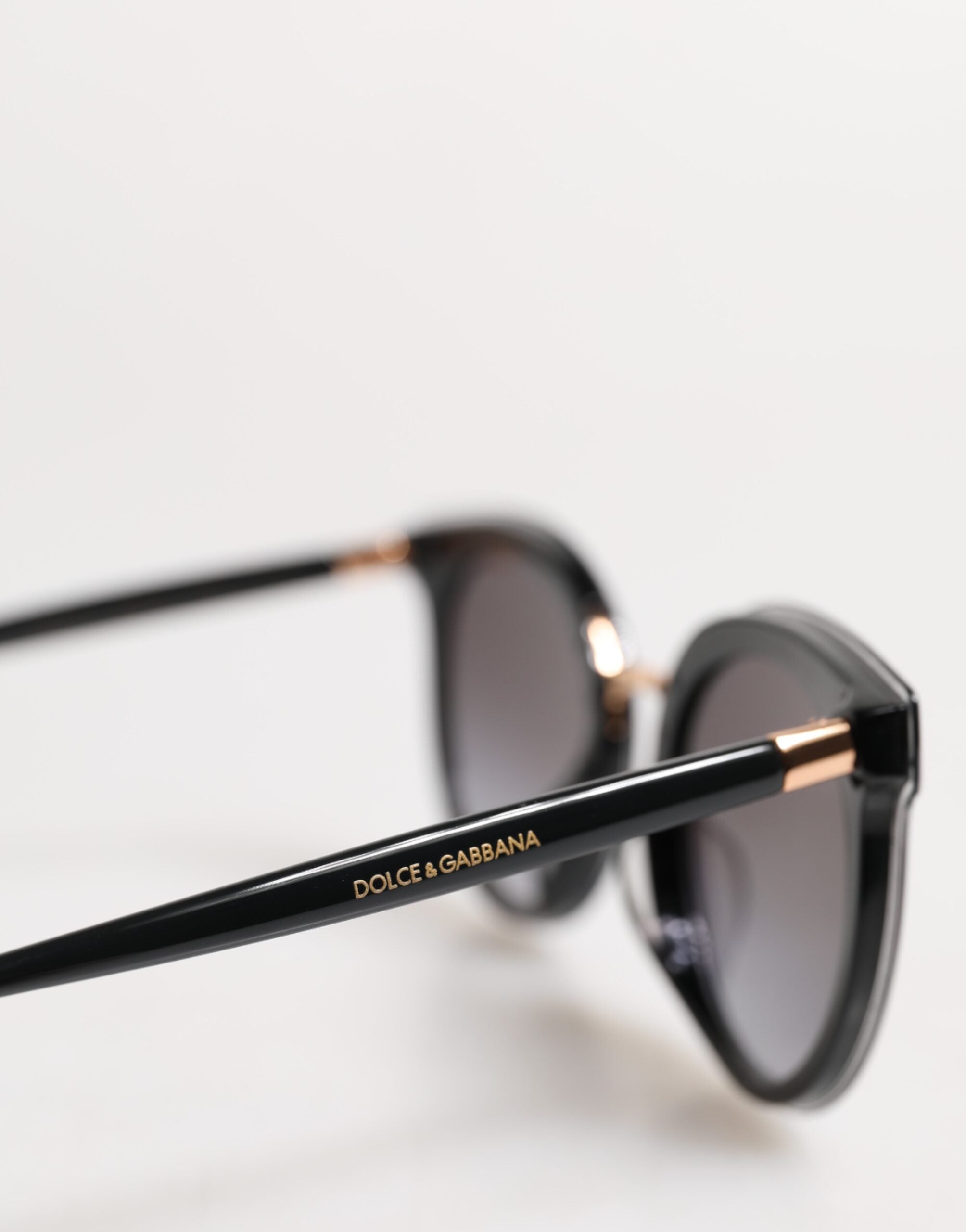 Dolce &amp; Gabbana – Runde Sonnenbrille DG4371-F mit transparentem Rand in Schwarz