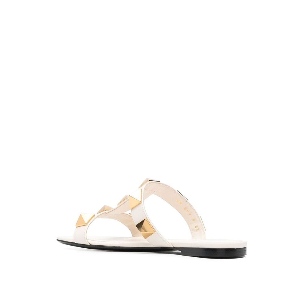 Sandales plates en cuir à clous romains Valentino Garavani