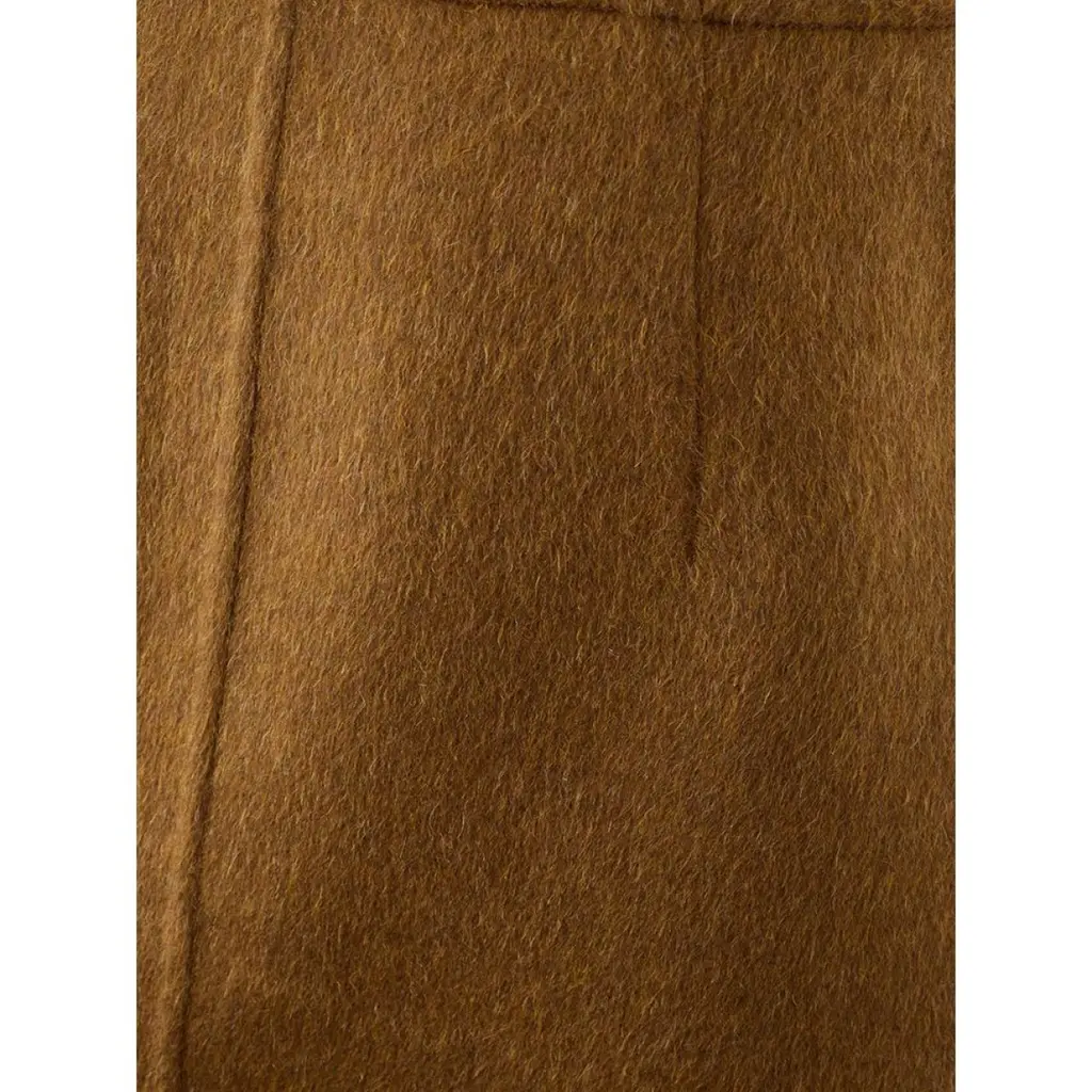 Close-up of brown Bottega Veneta wool skirt fabric texture showing soft wool material
