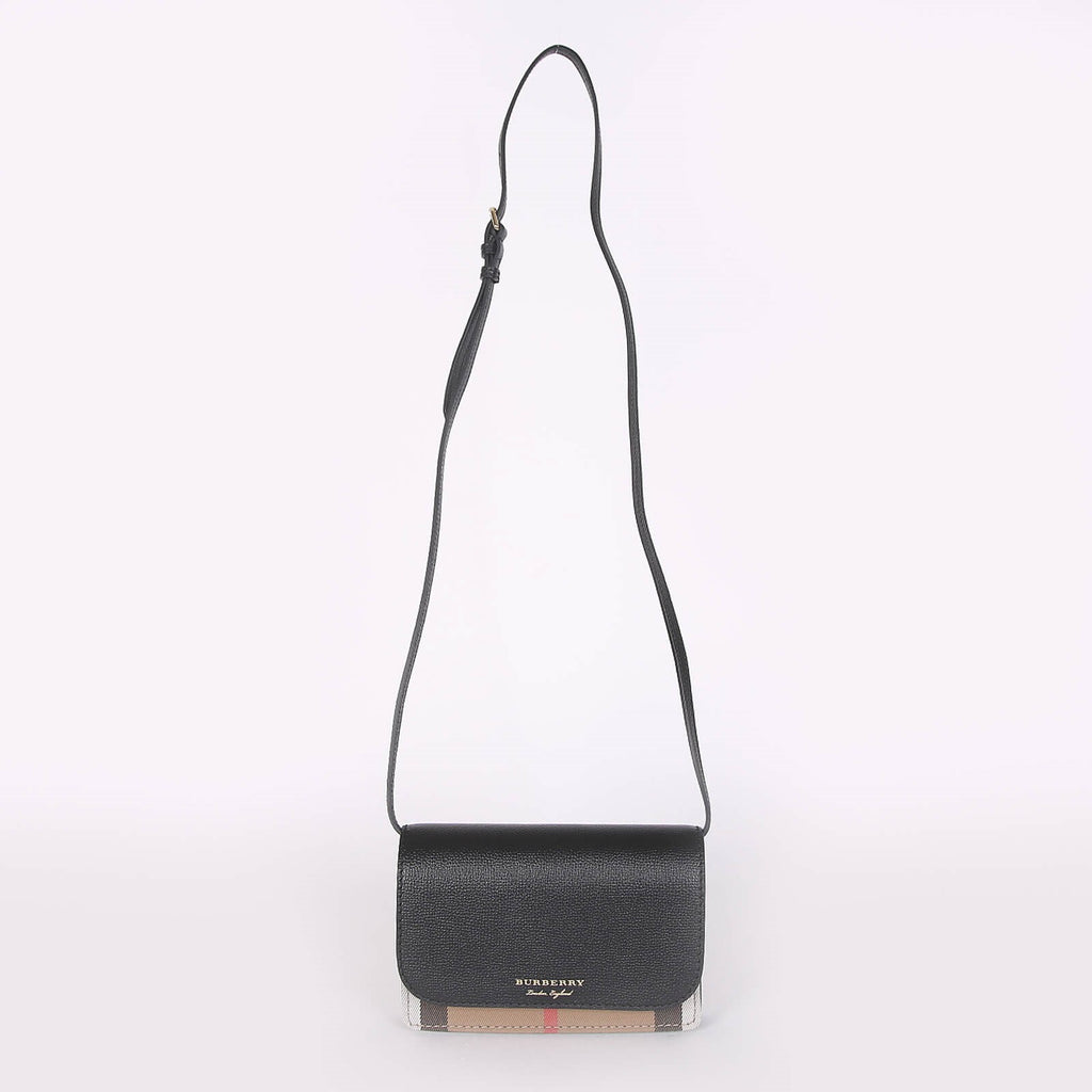 Burberry crossbody bag black with adjustable strap and signature check detail at the bottom