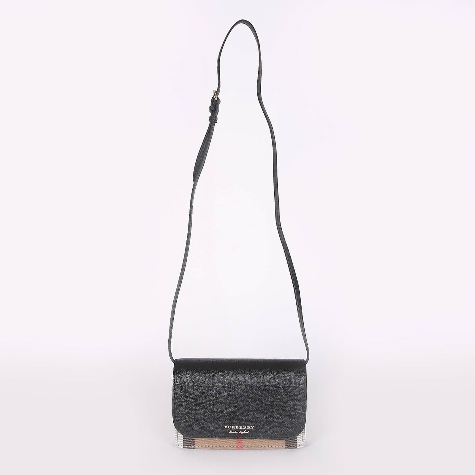 Burberry crossbody bag black with adjustable strap and signature check detail at the bottom