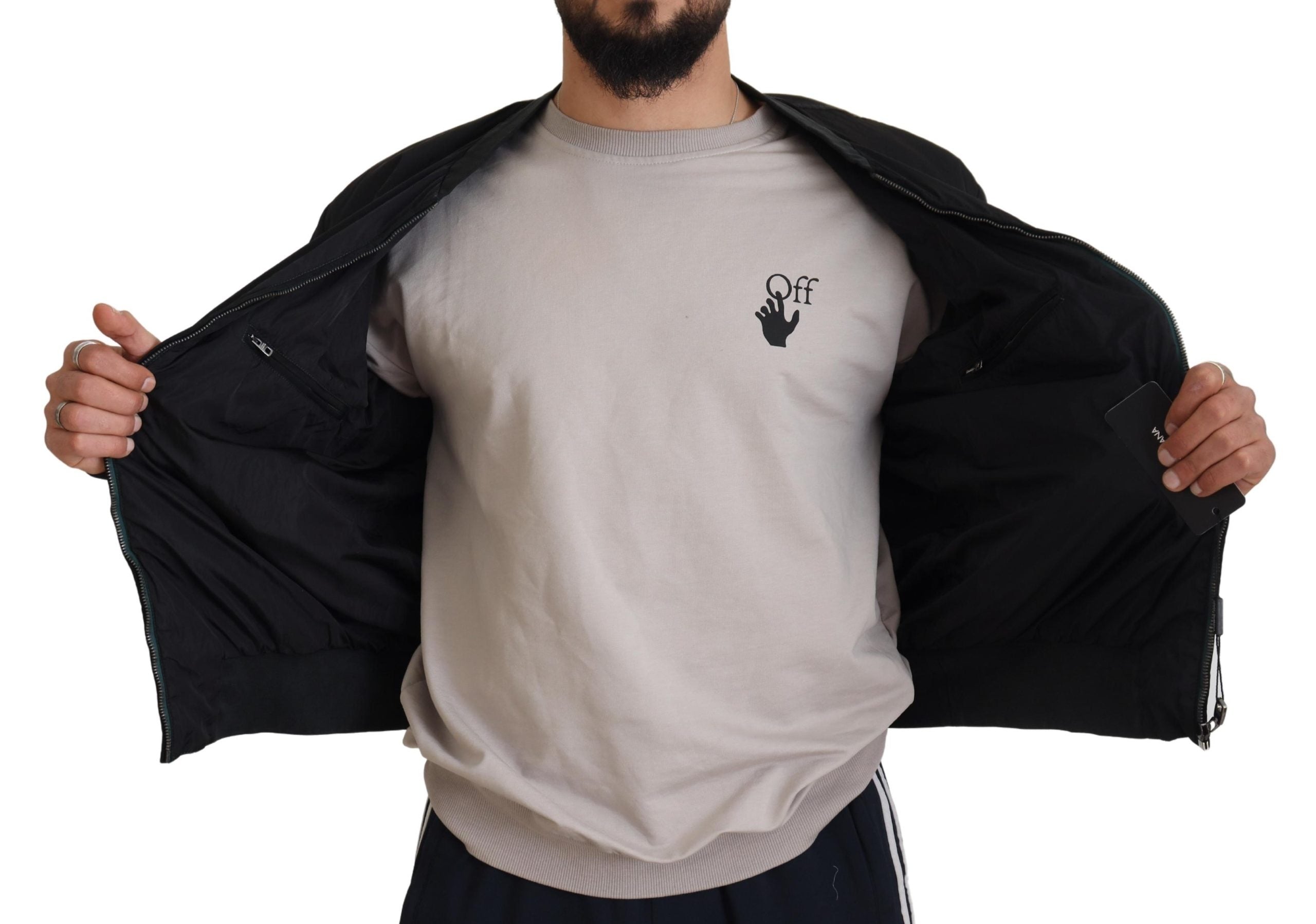 Man showing inside view of Dolce & Gabbana black bomber jacket with zip pockets and smooth lining