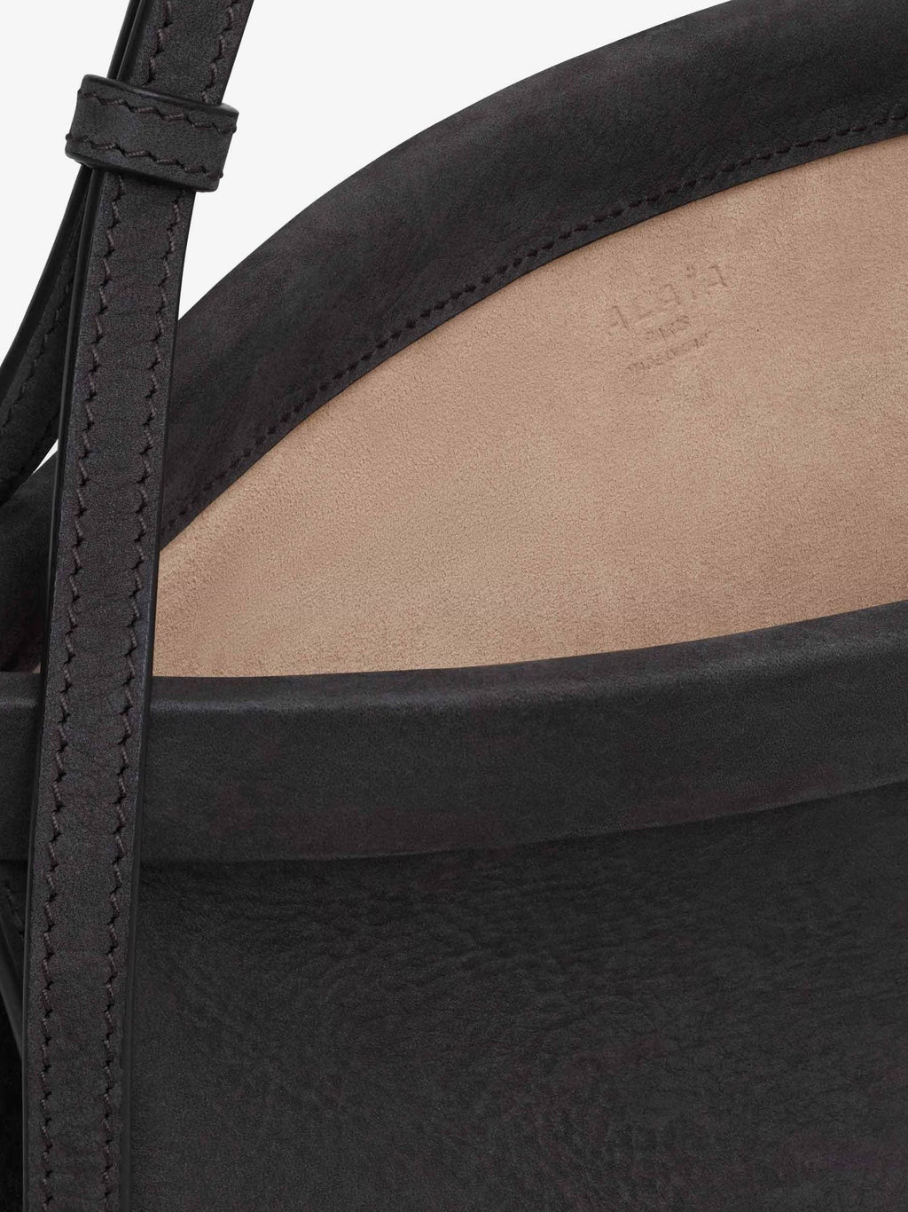 ALAIA East West leather shoulder bag with engraved lettering logo