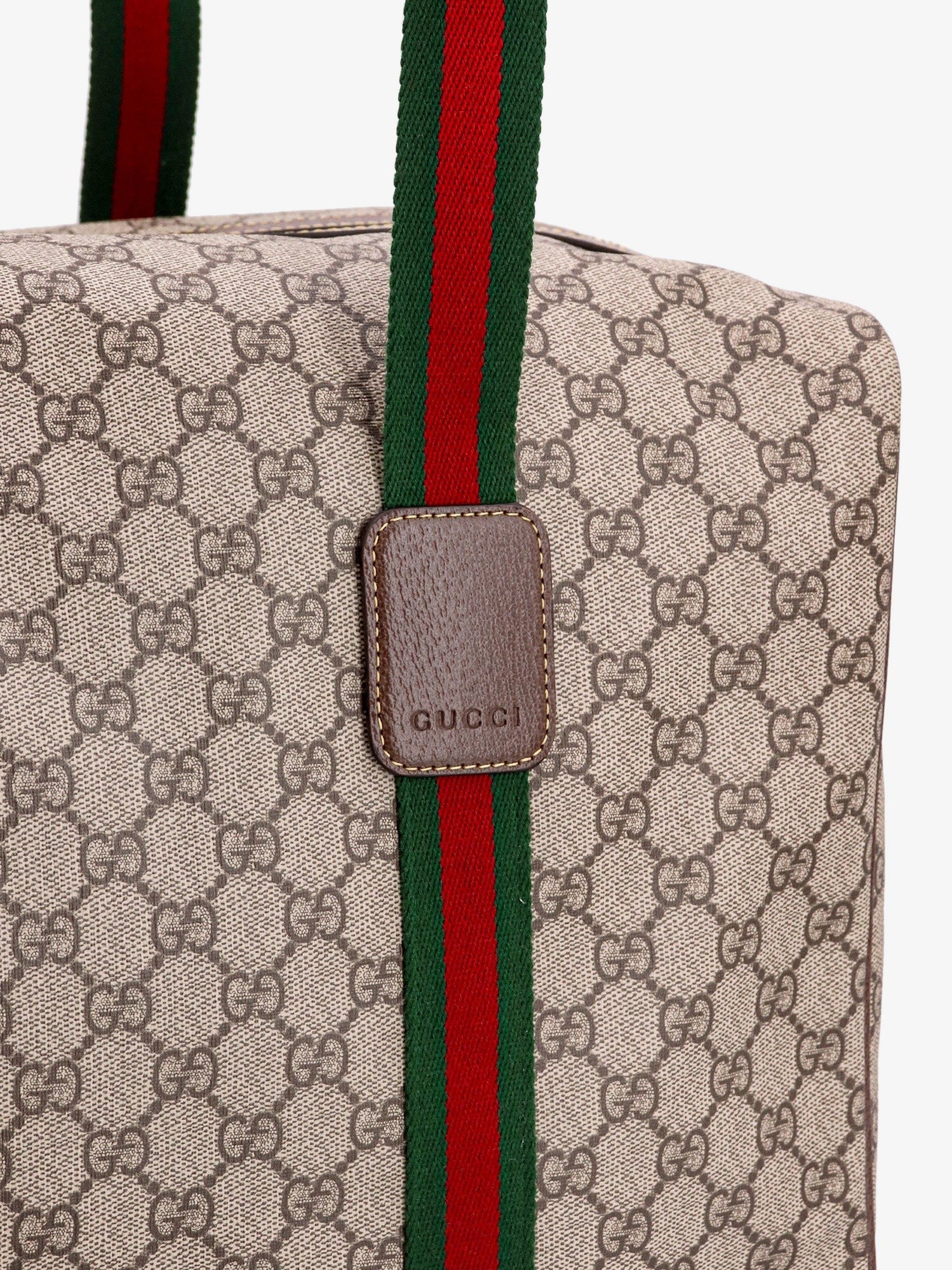 Gucci GG Supreme Fabric and leather travel bag with Web detail