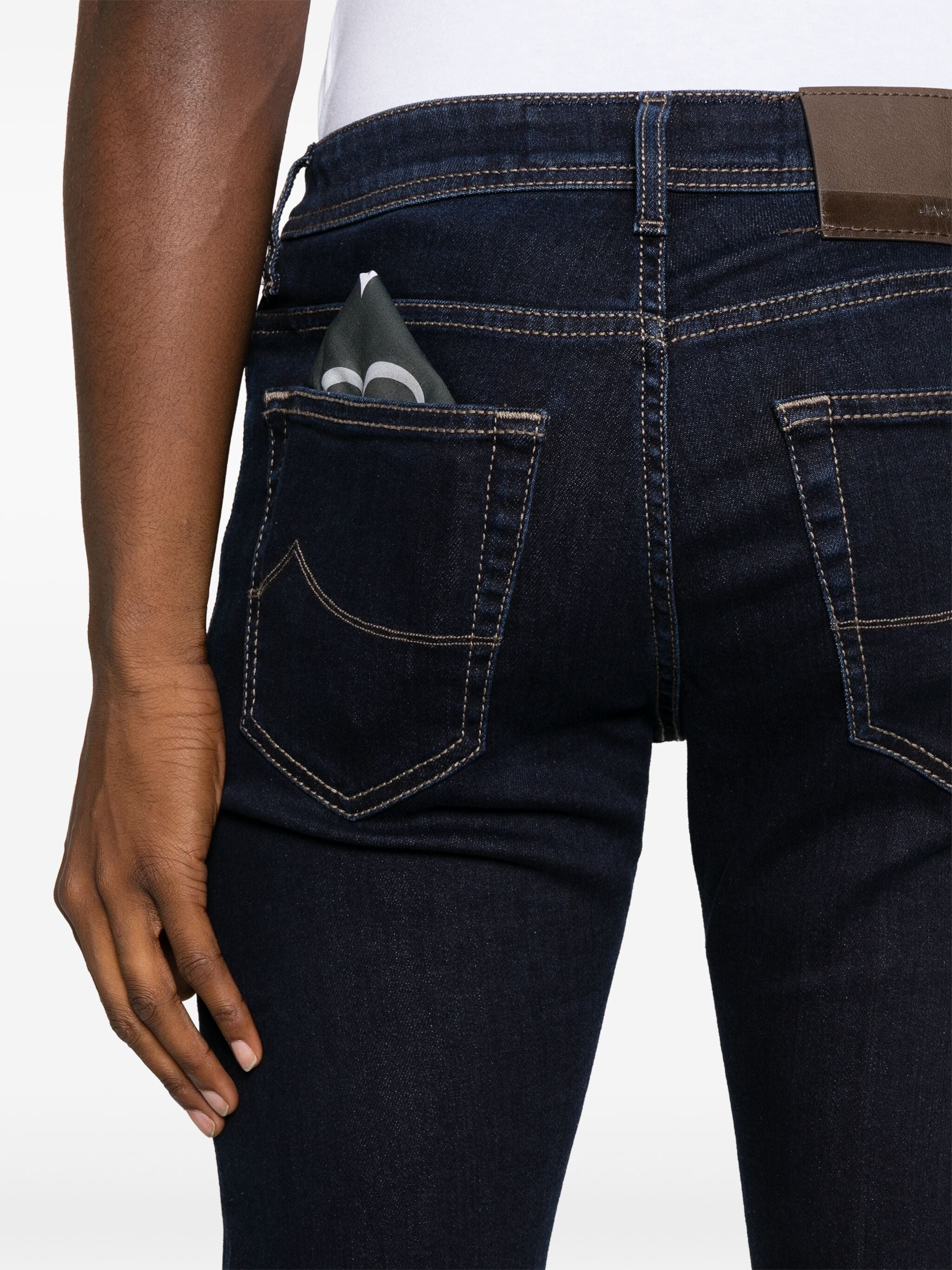 Back view of Jacob Cohen Nick Blue Jeans showing dark blue denim with detailed stitching and a hand beside the pocket