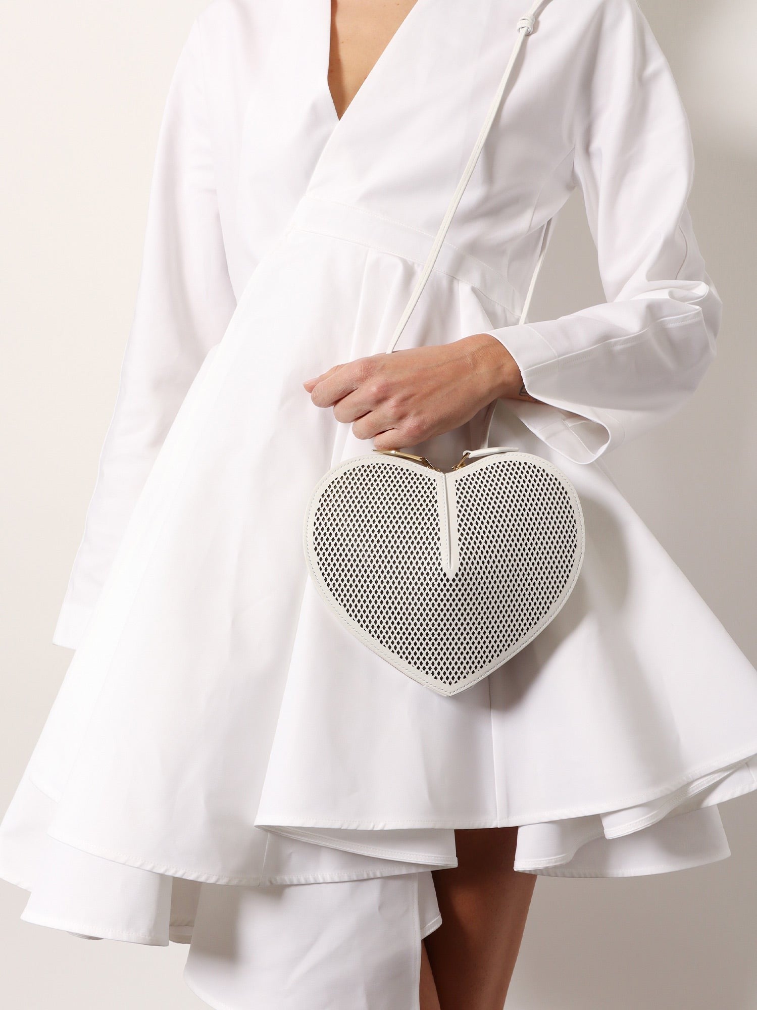 ALAIA Le coeur shoulder bag in leather with fishnet motif