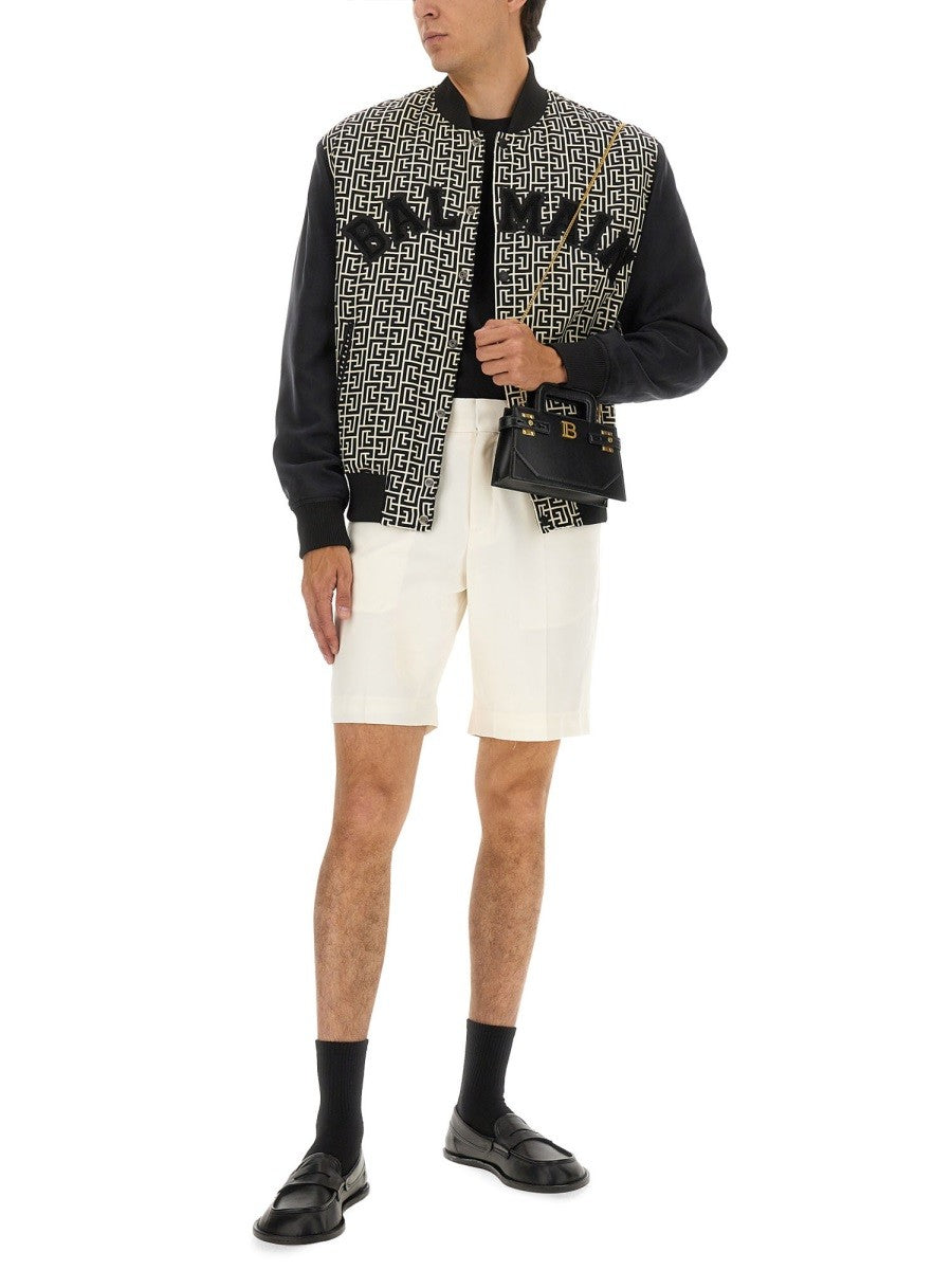 Balmain MONOGRAMMED VARSITY JACKET WITH PATCHES