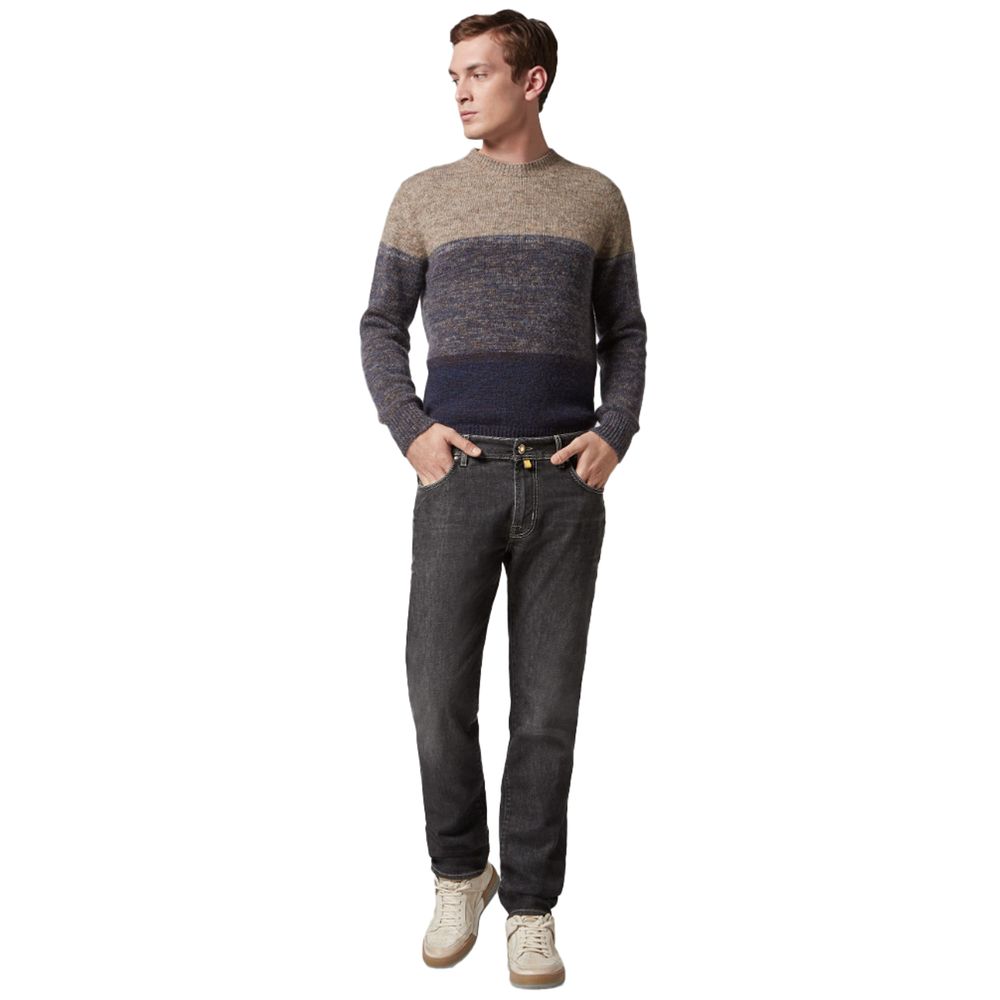 Jacob Cohen Nick Slim cotton jeans in black worn by a man with a colorblock sweater and white sneakers